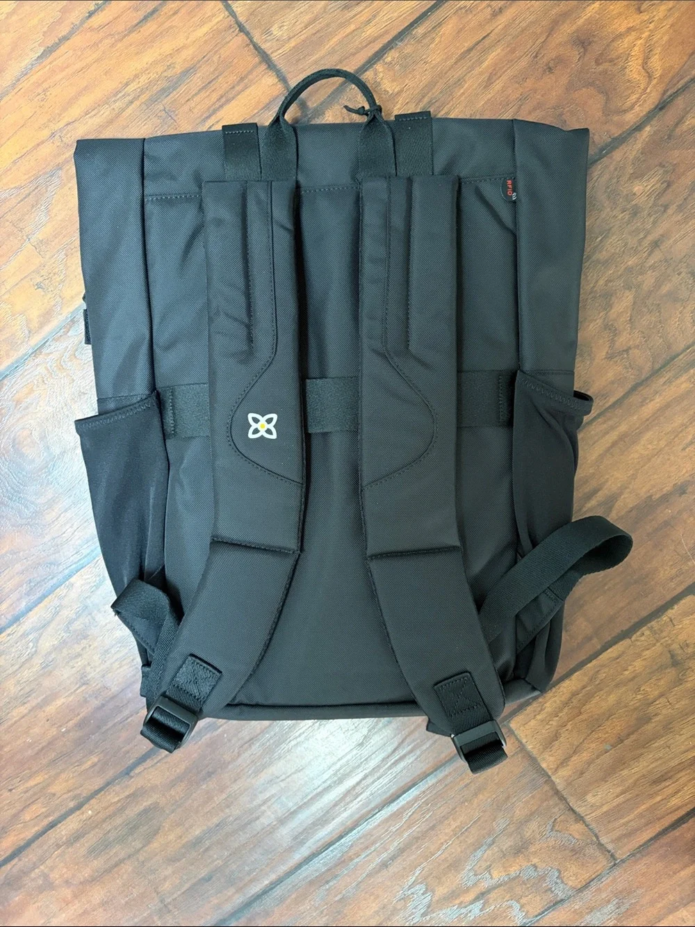 Sherpani Black Fold-Top Sedona Backpack with Front Buckles. Water resistant